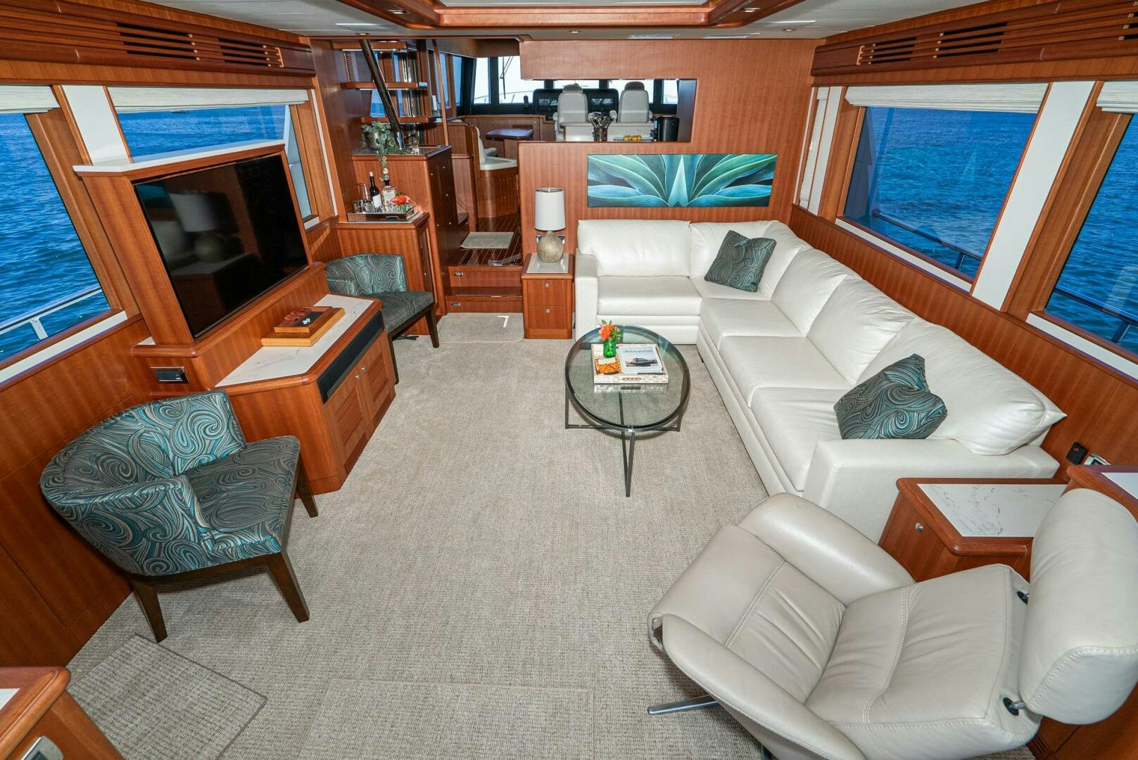 a living room with a couch and a table aboard KING OF NOTHING Yacht for Sale
