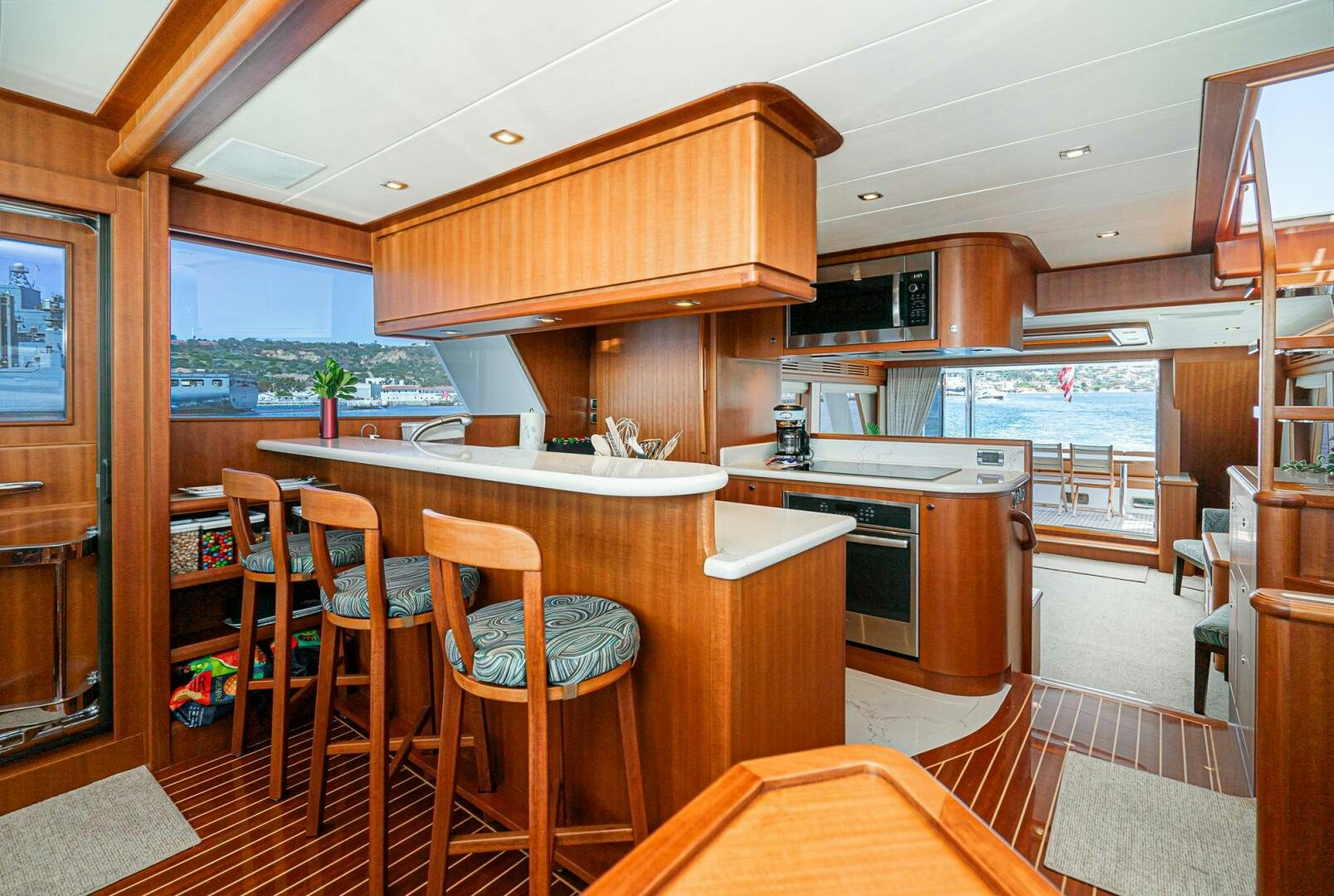 a kitchen with wooden cabinets aboard KING OF NOTHING Yacht for Sale