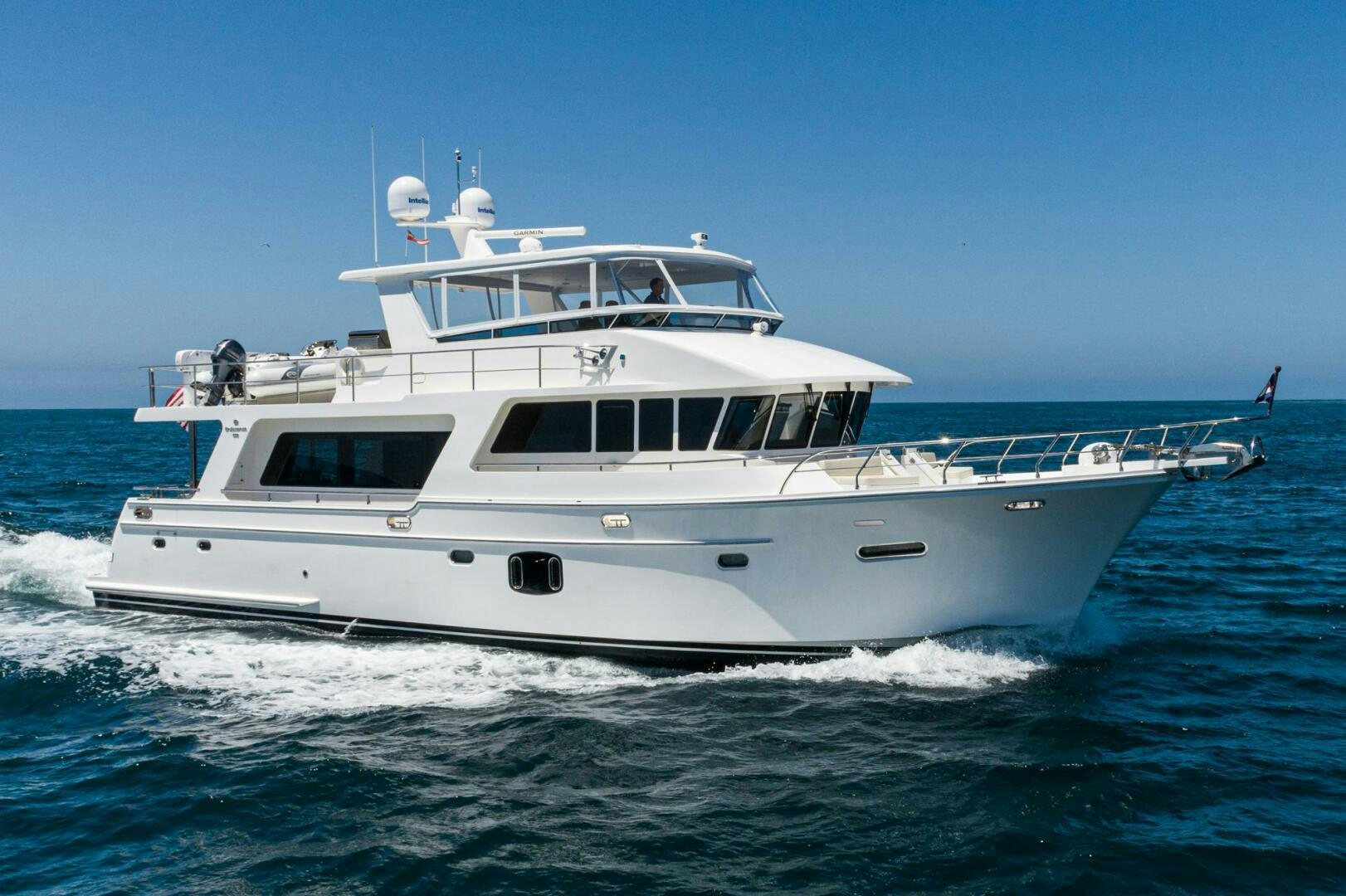 a white yacht on the water aboard KING OF NOTHING Yacht for Sale