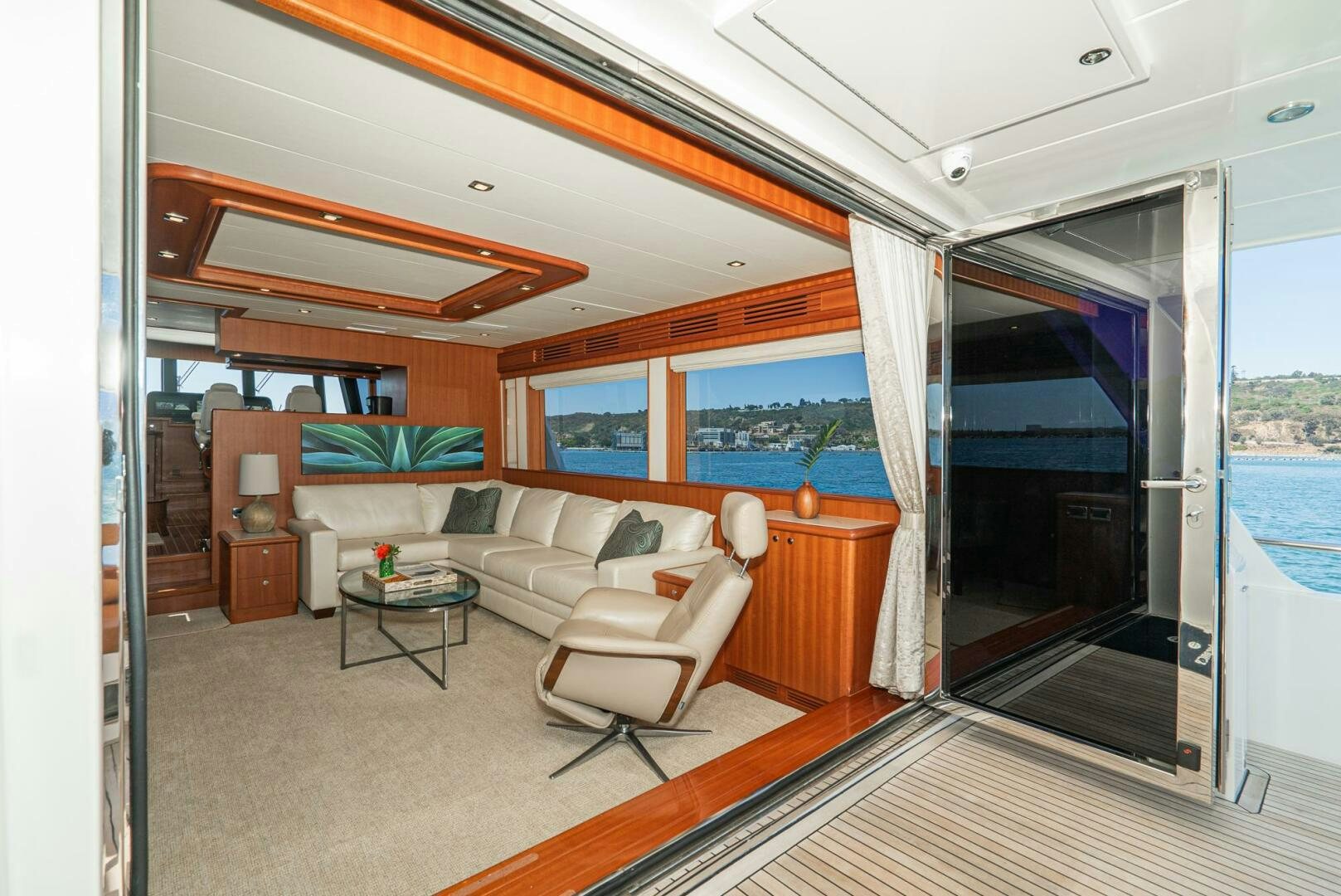 a living room with a large window aboard KING OF NOTHING Yacht for Sale