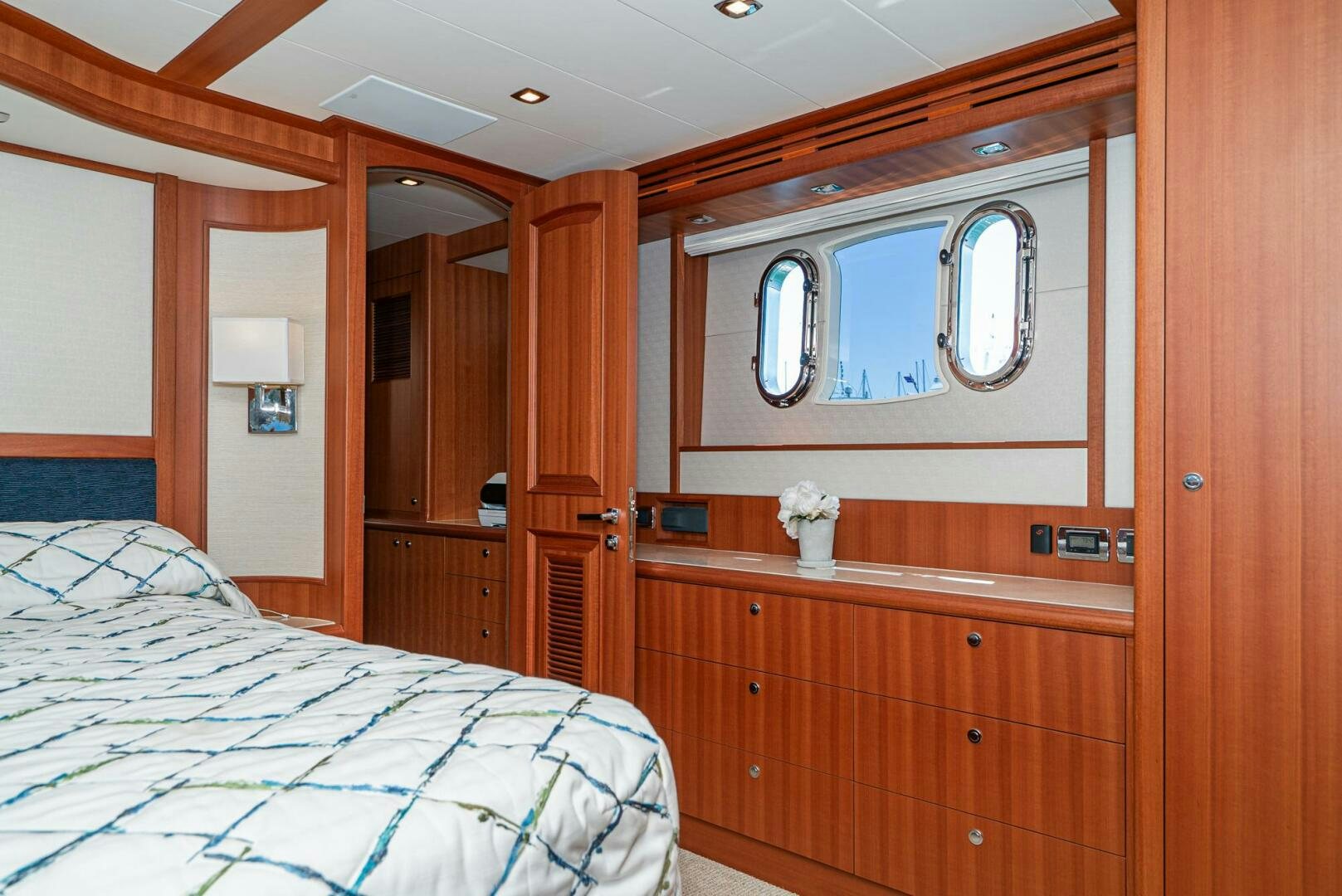 a bedroom with a mirror and a bed aboard KING OF NOTHING Yacht for Sale