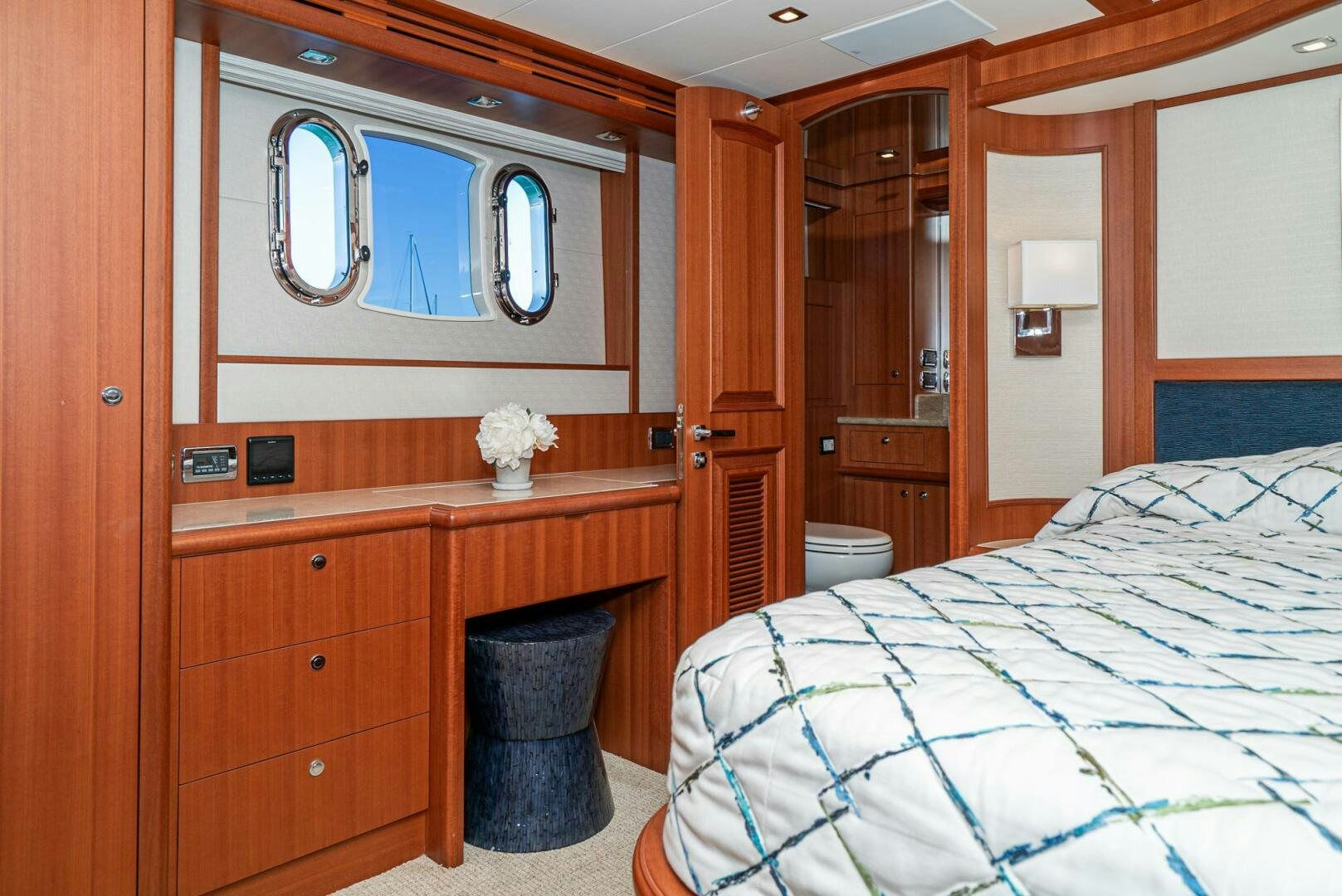a bathroom with a mirror and a bed aboard KING OF NOTHING Yacht for Sale