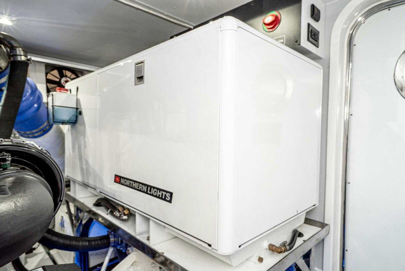 a white machine with a red light aboard KING OF NOTHING Yacht for Sale