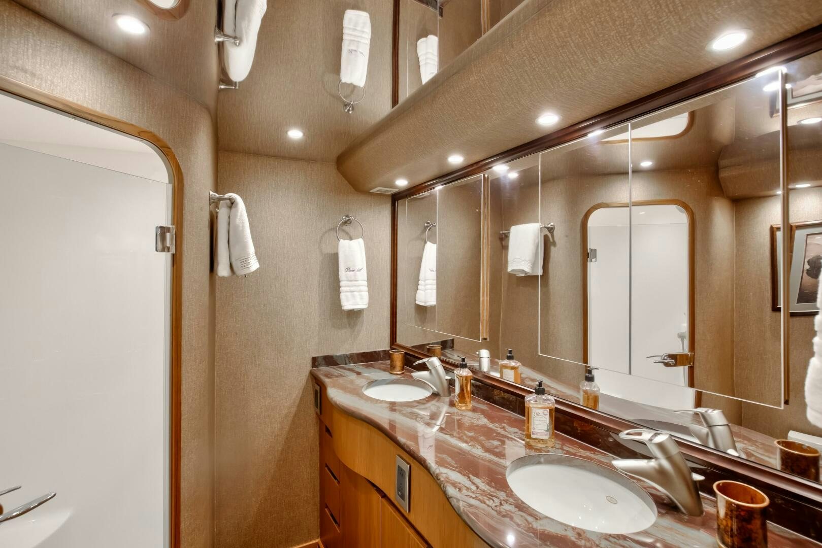 a bathroom with a large mirror aboard DONE DEAL Yacht for Sale