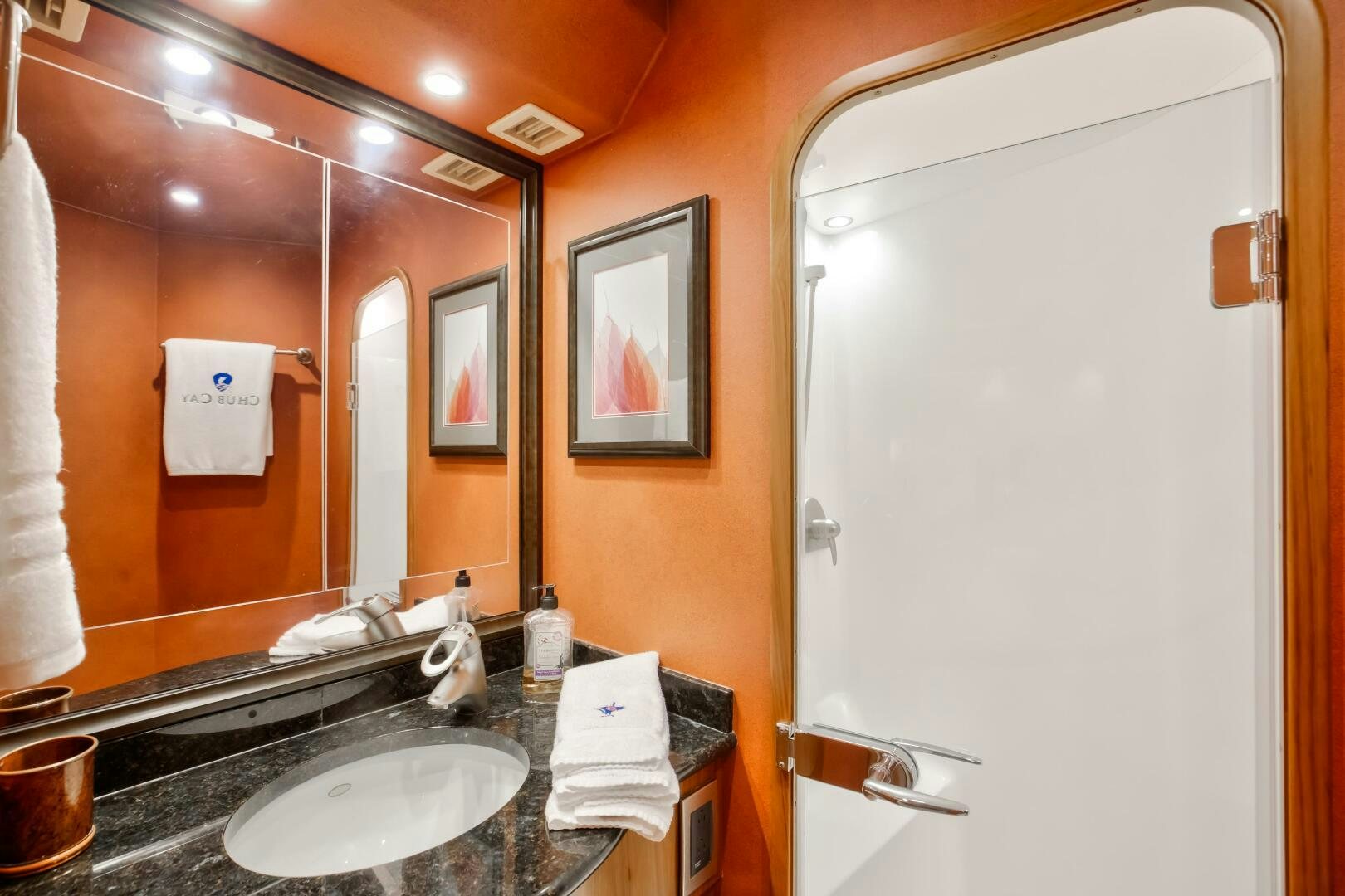 a bathroom with a large mirror aboard DONE DEAL Yacht for Sale