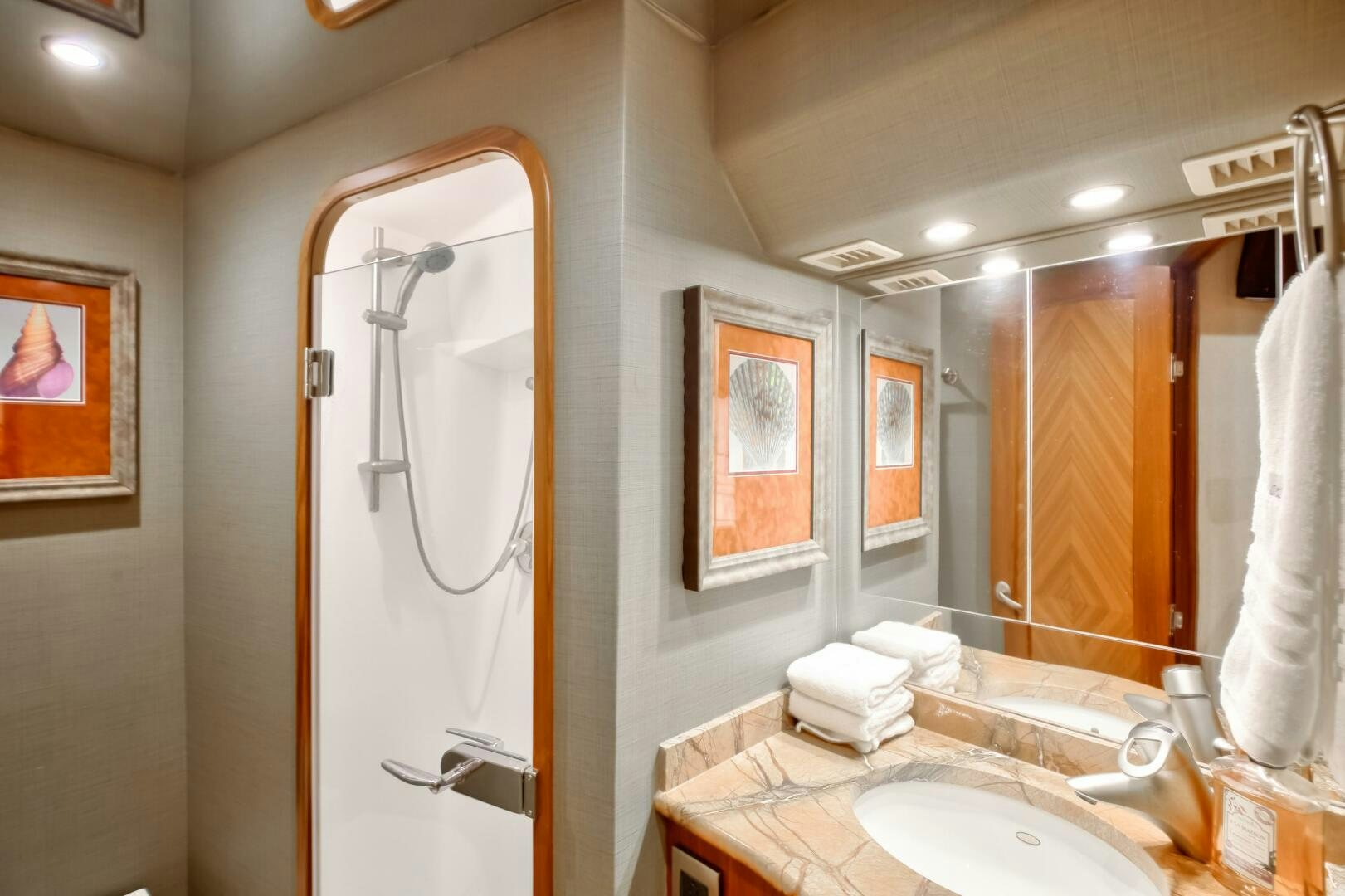 a bathroom with a large mirror aboard DONE DEAL Yacht for Sale
