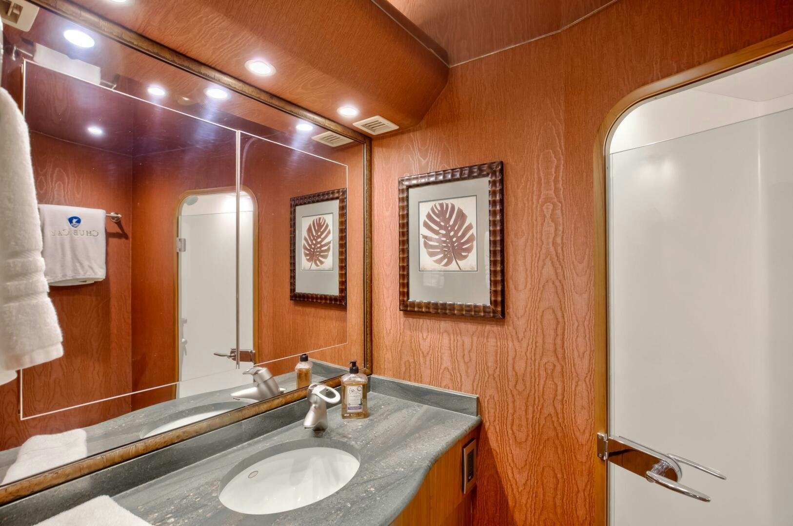 a bathroom with a large mirror aboard DONE DEAL Yacht for Sale