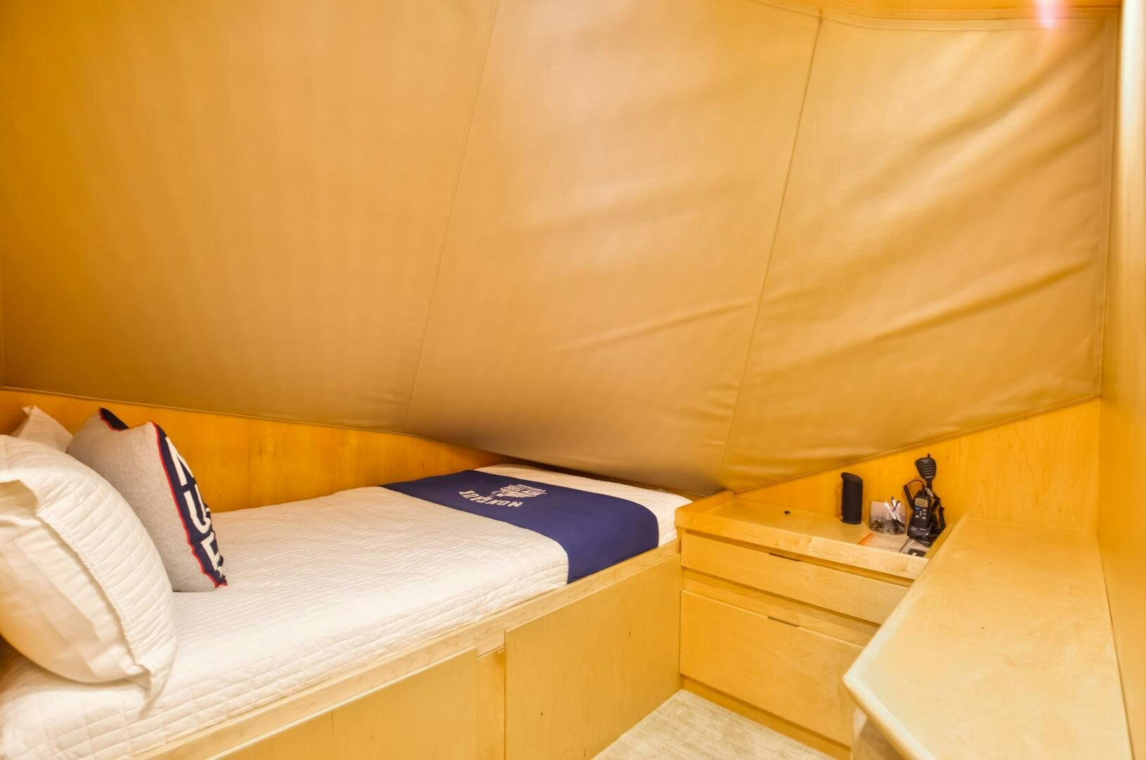 a bed with a blue sheet aboard DONE DEAL Yacht for Sale