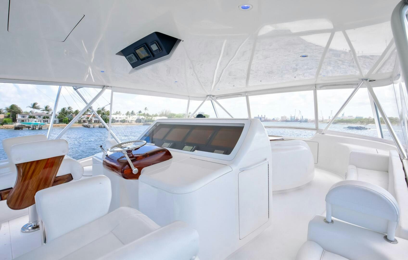 a white boat with a laptop on it aboard DONE DEAL Yacht for Sale