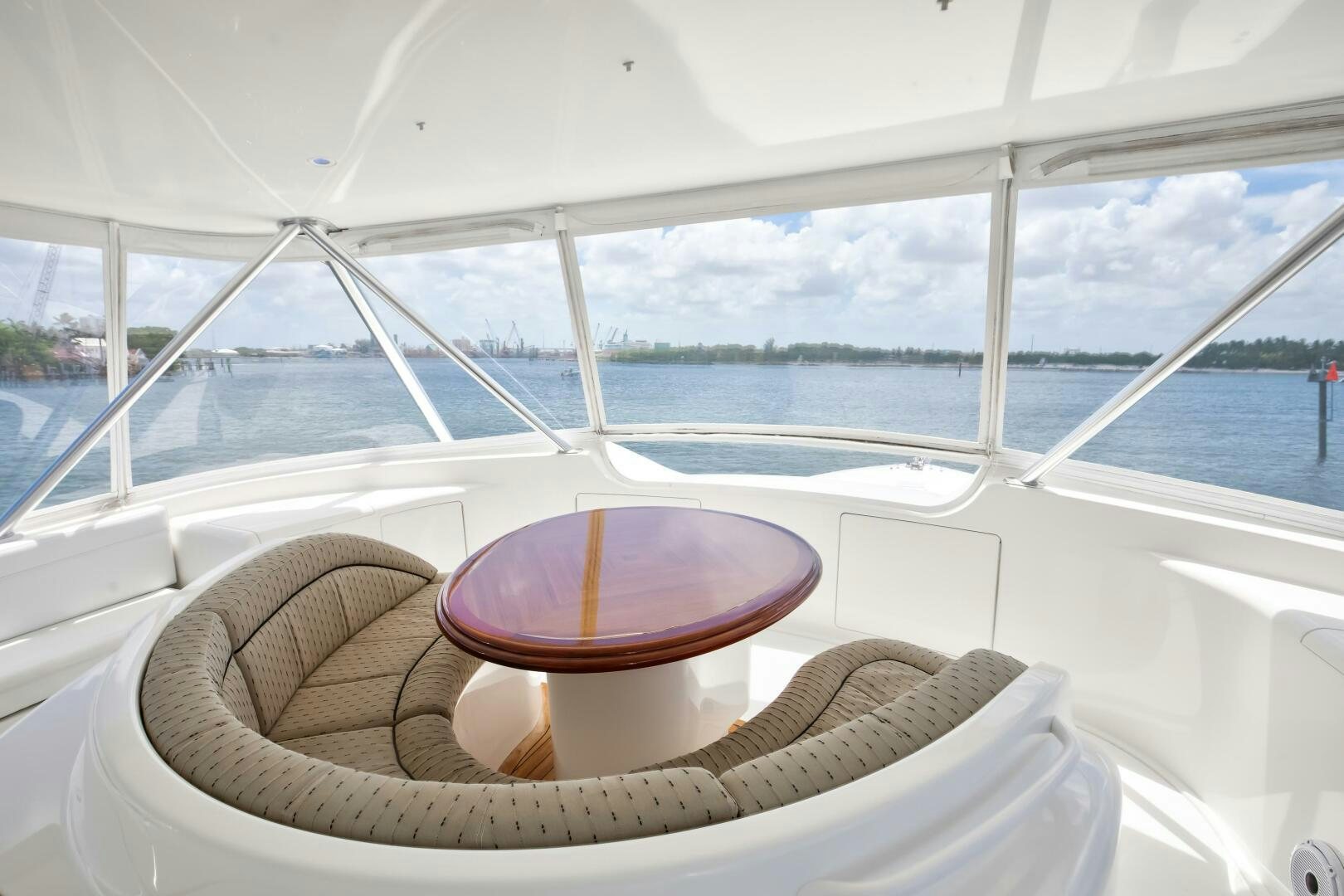 a boat with a round table on the front aboard DONE DEAL Yacht for Sale