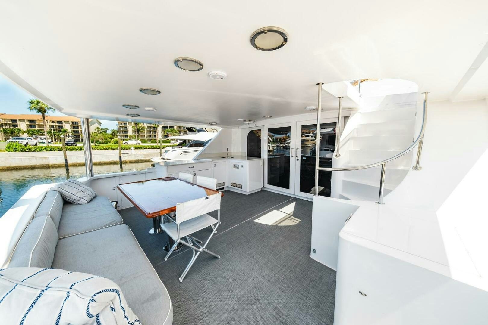a room with a couch and a table and chairs aboard GRACE Yacht for Sale
