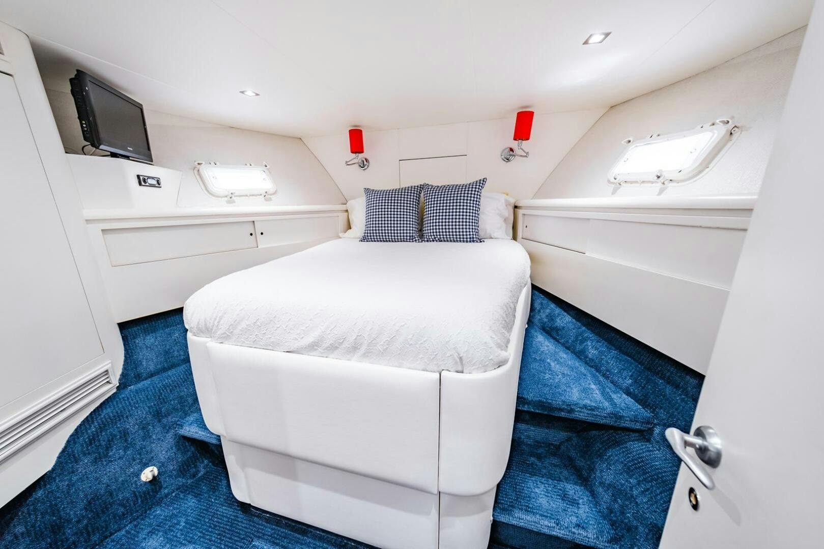 a small room with a bed and a desk aboard GRACE Yacht for Sale