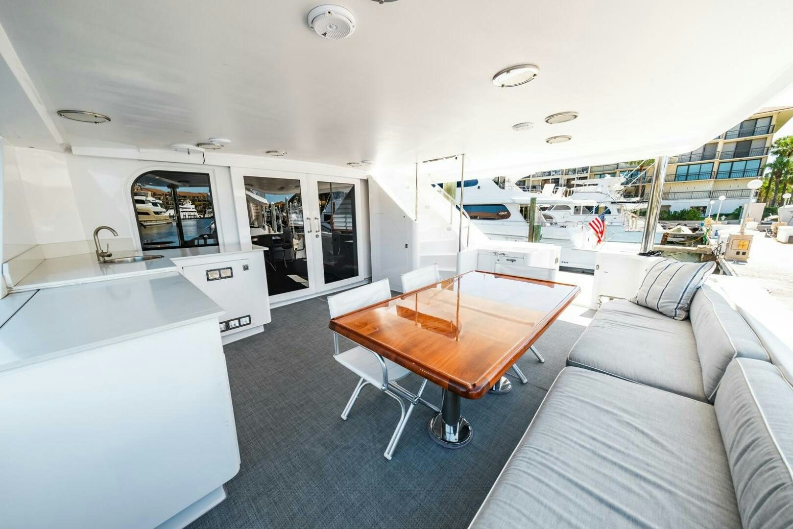 a living room with a couch and a table aboard GRACE Yacht for Sale