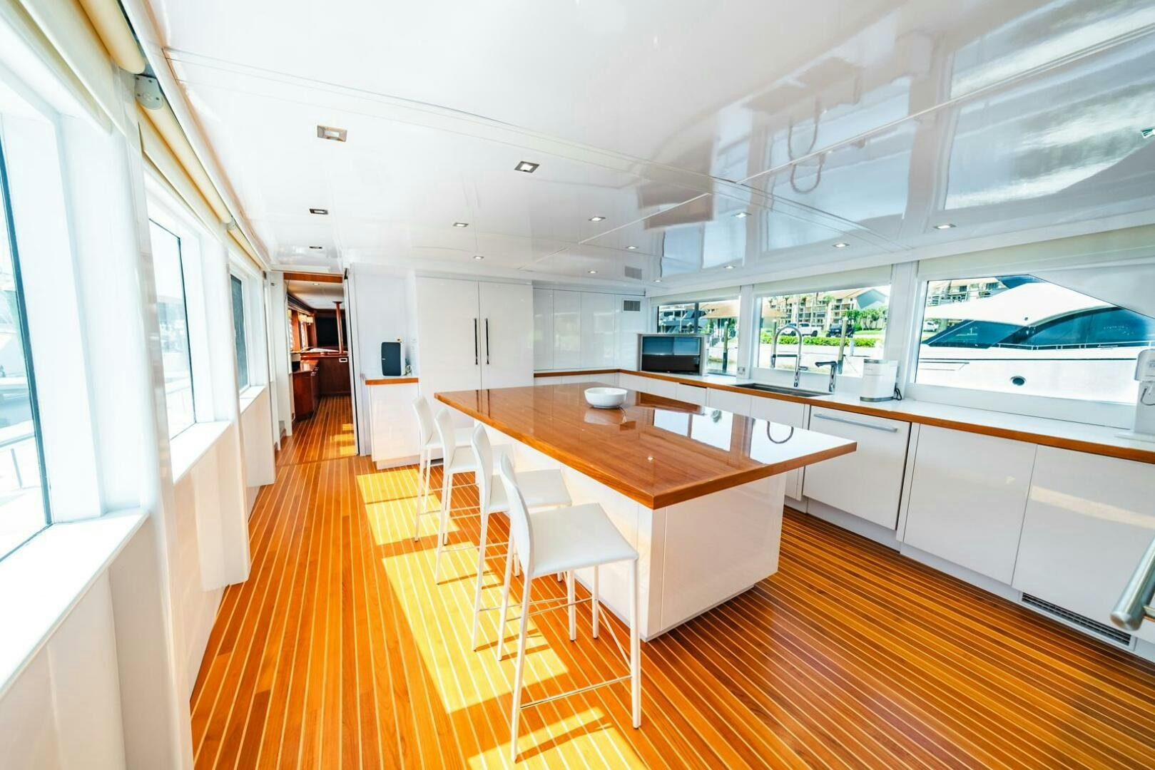 a long wooden table in a room aboard GRACE Yacht for Sale