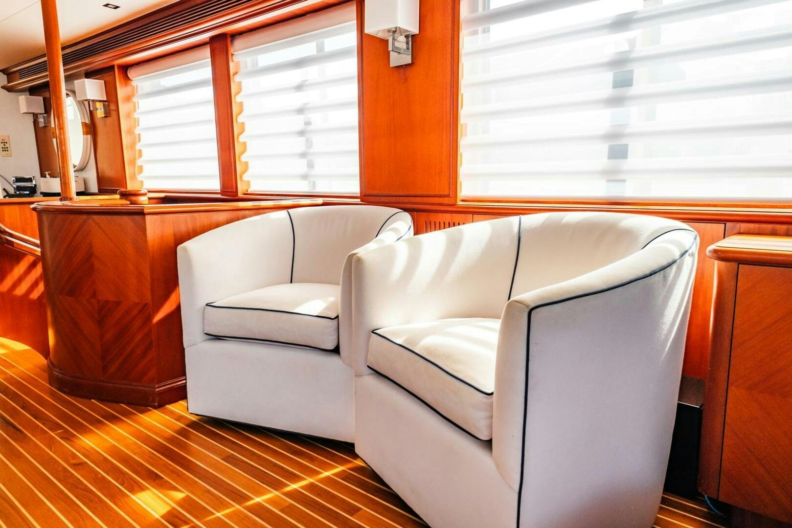 a room with couches and a table aboard GRACE Yacht for Sale