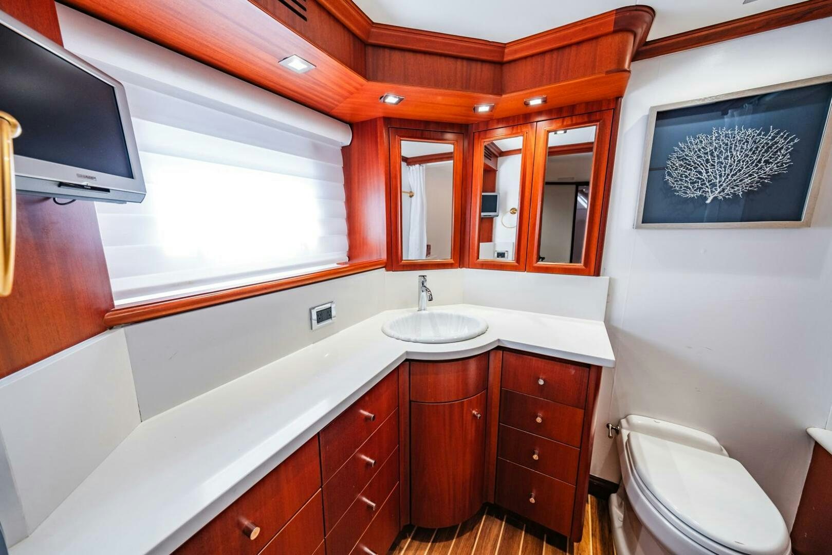 a bathroom with a sink and a toilet aboard GRACE Yacht for Sale