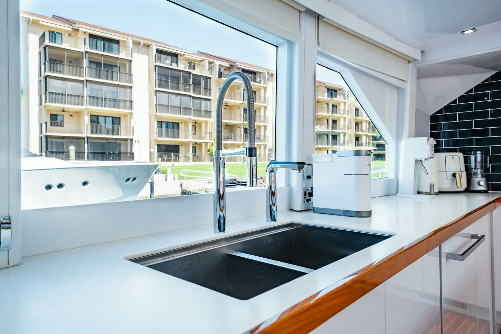 a kitchen with a sink and cabinets aboard GRACE Yacht for Sale