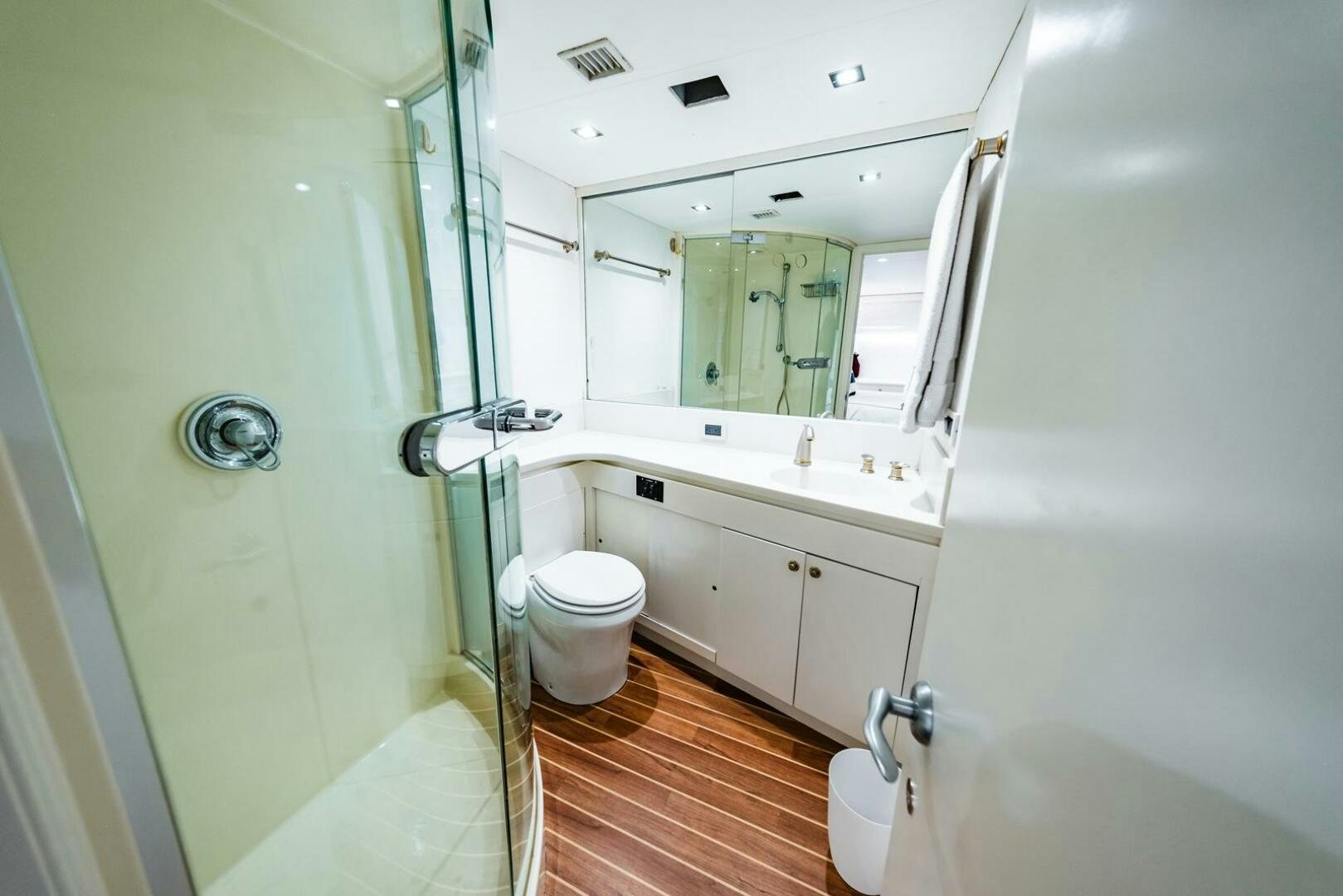 a bathroom with a tub sink and toilet aboard GRACE Yacht for Sale