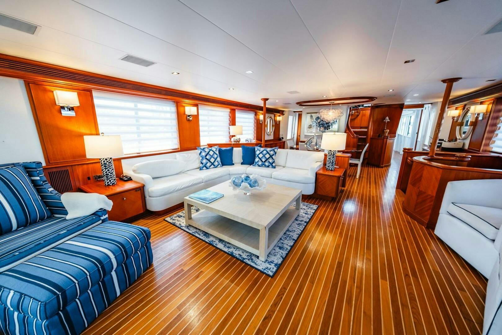 a living room with a couch and a coffee table aboard GRACE Yacht for Sale