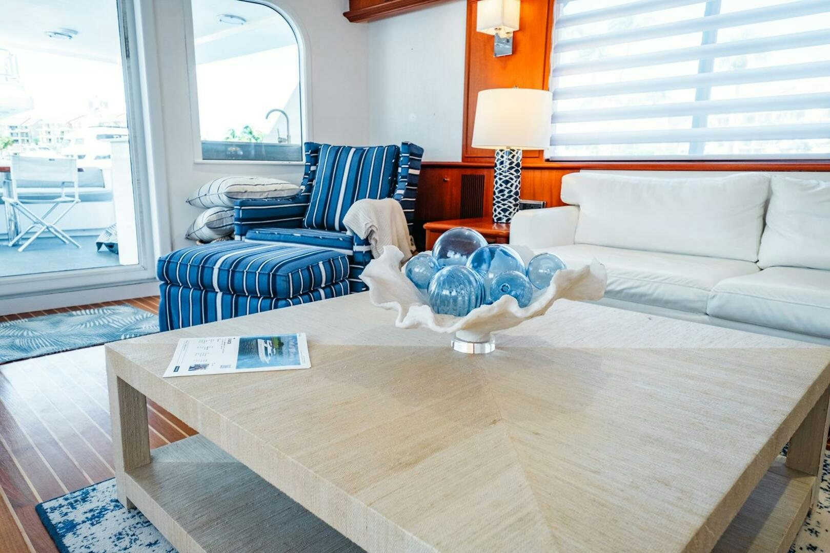a living room with a large window aboard GRACE Yacht for Sale