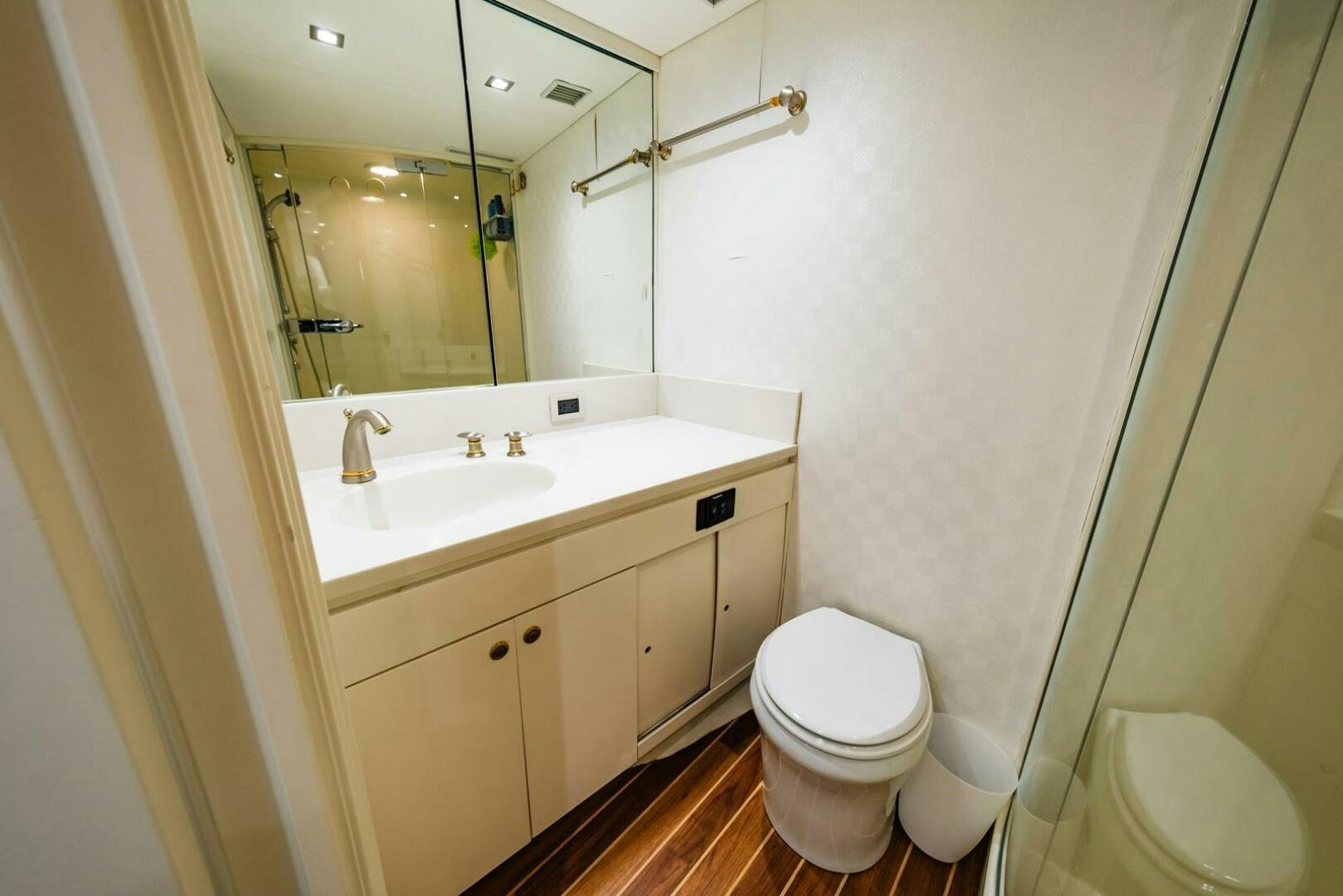 a bathroom with a toilet and sink aboard GRACE Yacht for Sale