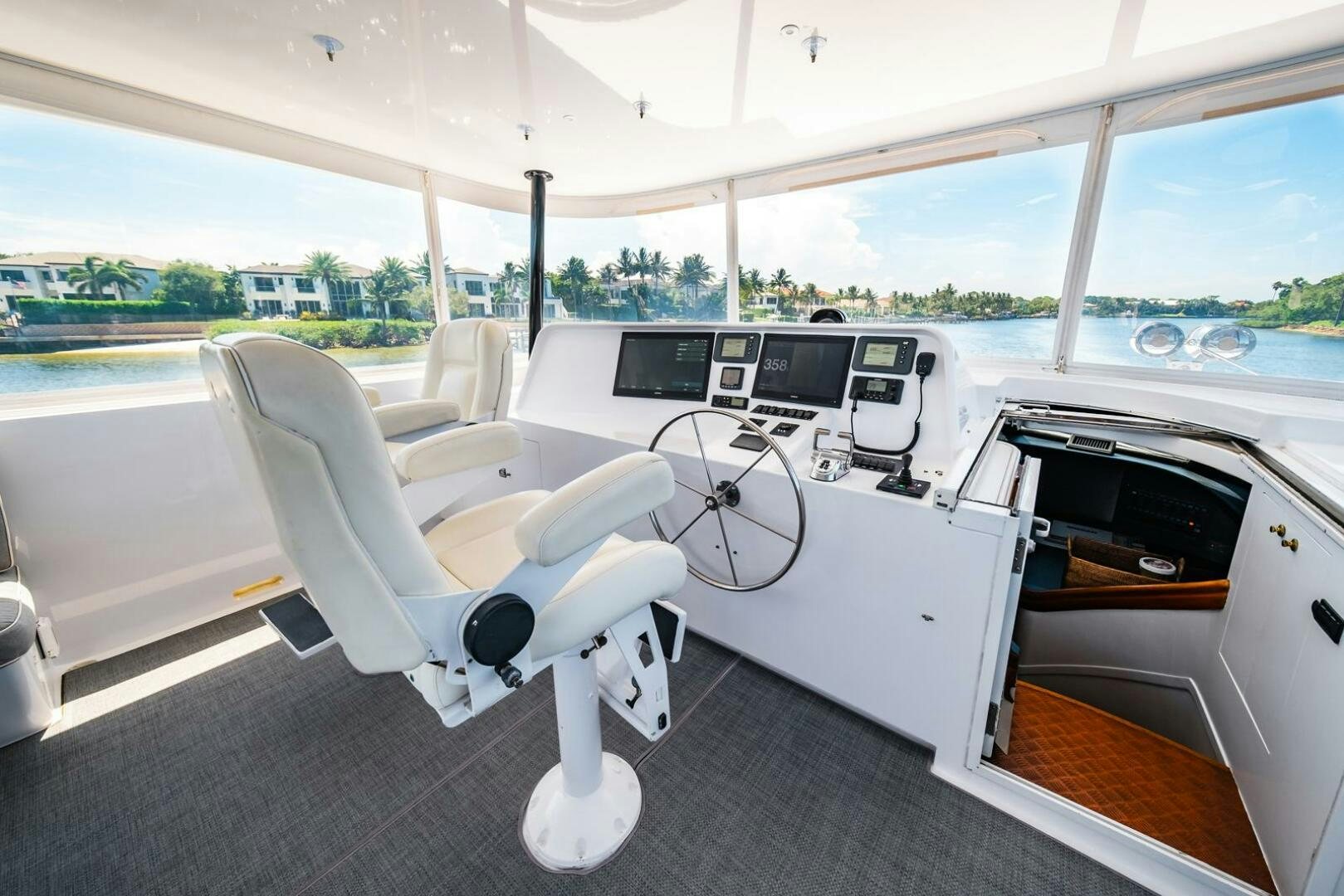 a boat with a desk and chairs aboard GRACE Yacht for Sale