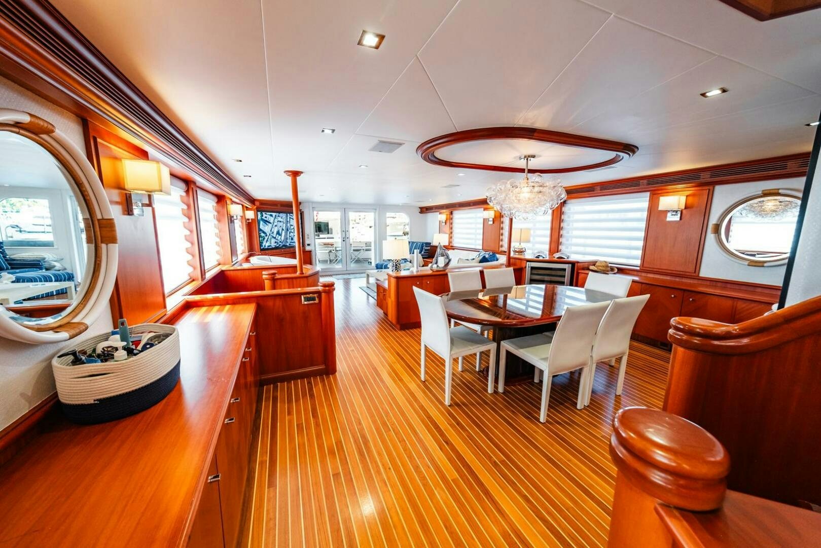 a large room with a table and chairs aboard GRACE Yacht for Sale