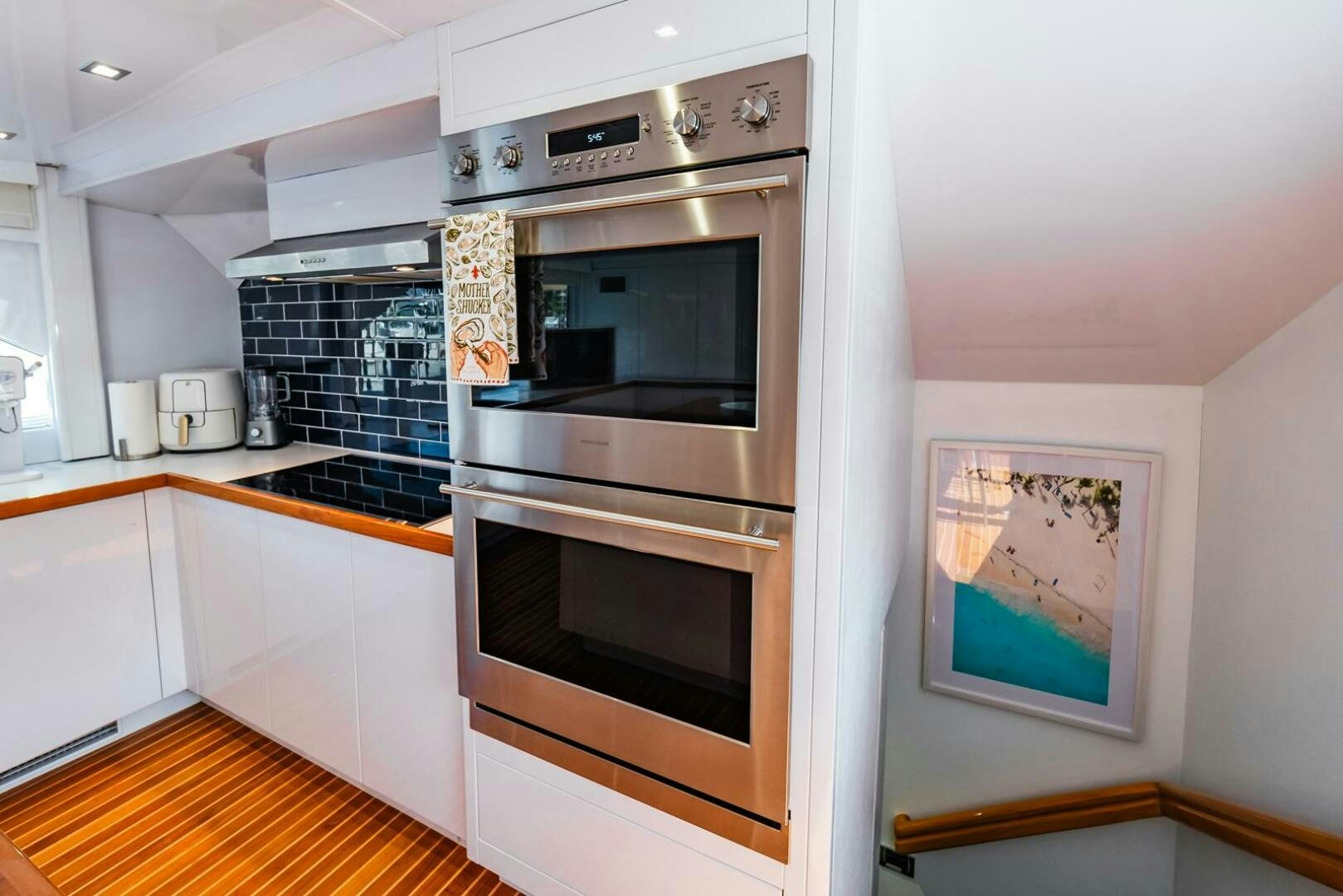 a kitchen with a stove and oven aboard GRACE Yacht for Sale