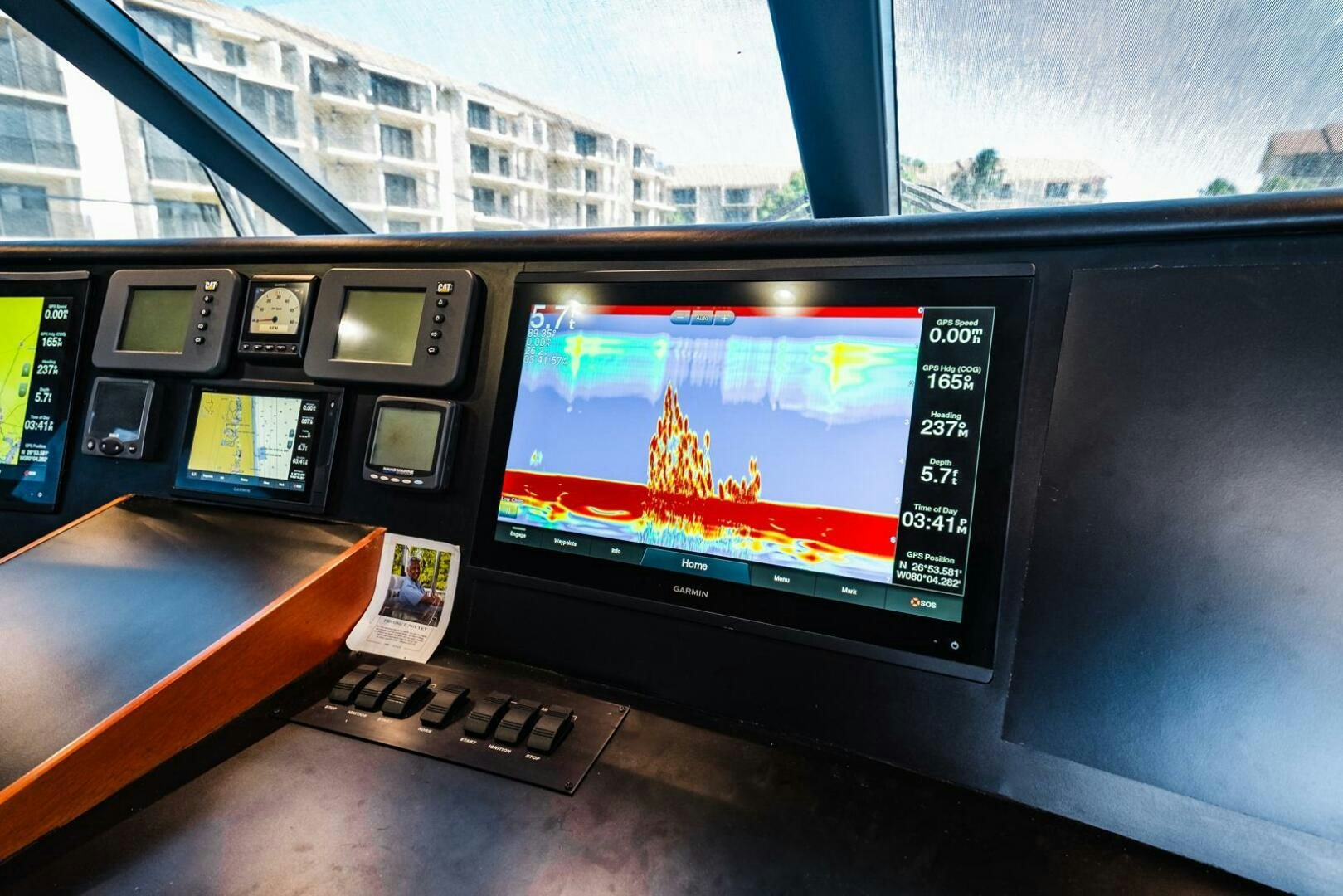 a laptop computer on a desk aboard GRACE Yacht for Sale