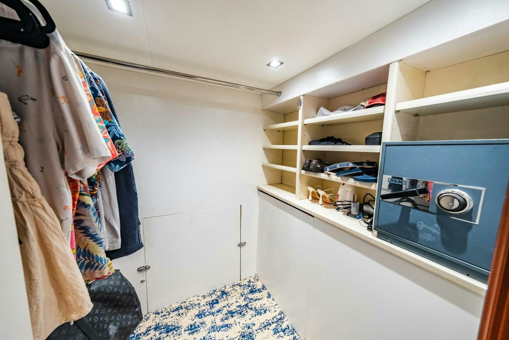 a room with a tv and clothes aboard GRACE Yacht for Sale