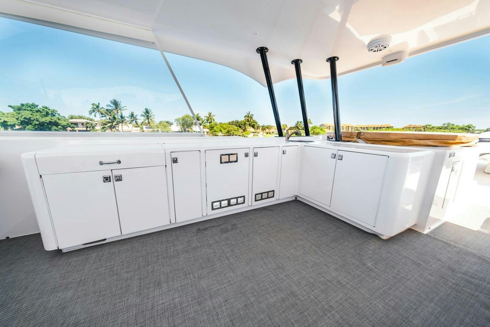 a white garage with a black pole aboard GRACE Yacht for Sale