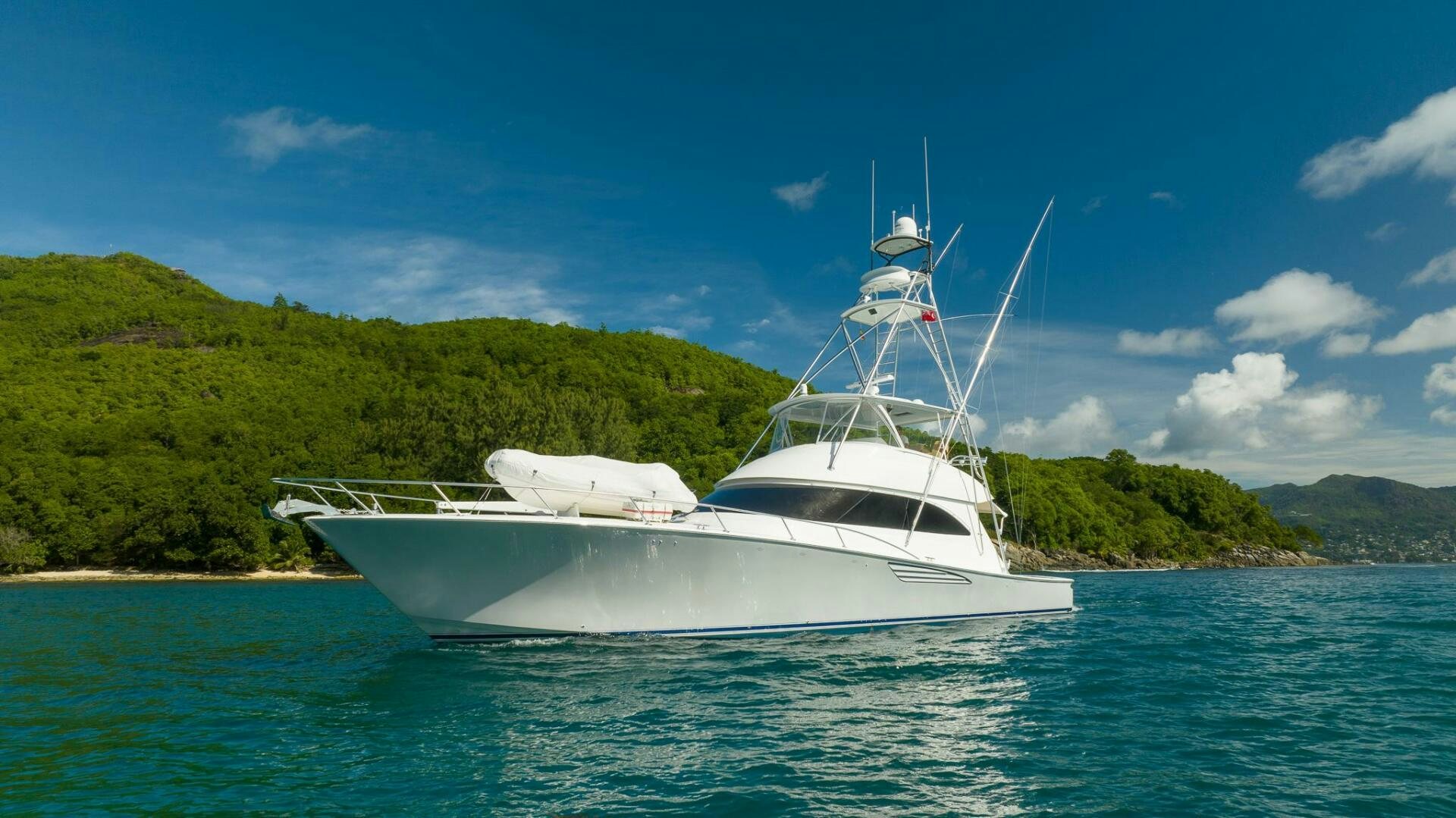 a white boat on the water aboard VOODOO Yacht for Sale