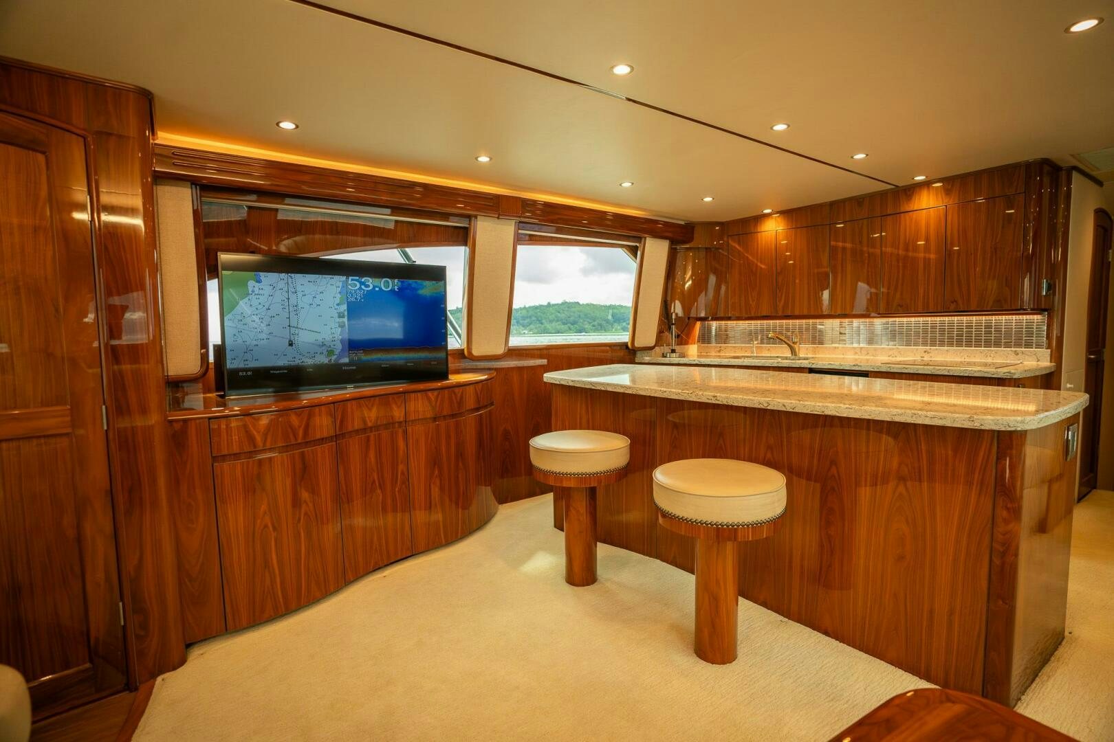 a bathroom with a large tv aboard VOODOO Yacht for Sale