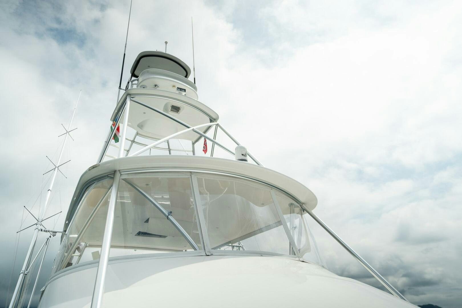 a white boat with a white sail aboard VOODOO Yacht for Sale