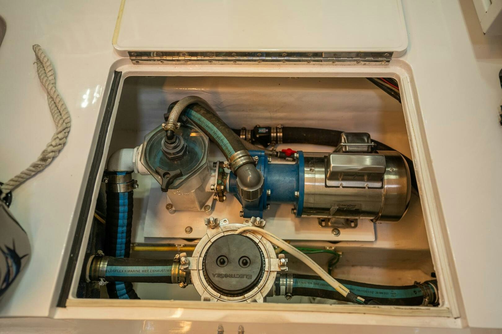 a metal box with a blue and silver object inside aboard VOODOO Yacht for Sale