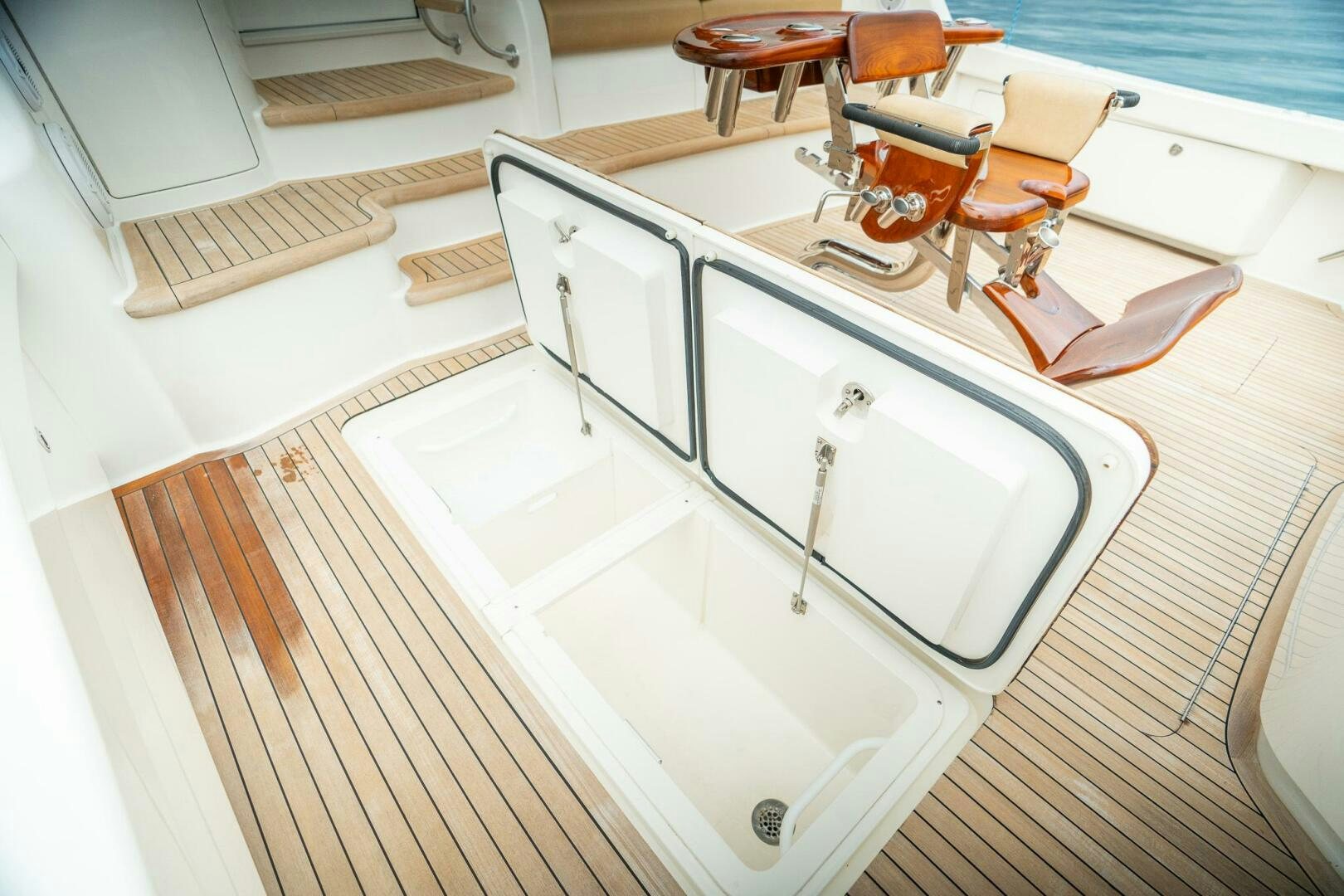a white rectangular object with a metal frame on a wooden surface aboard VOODOO Yacht for Sale