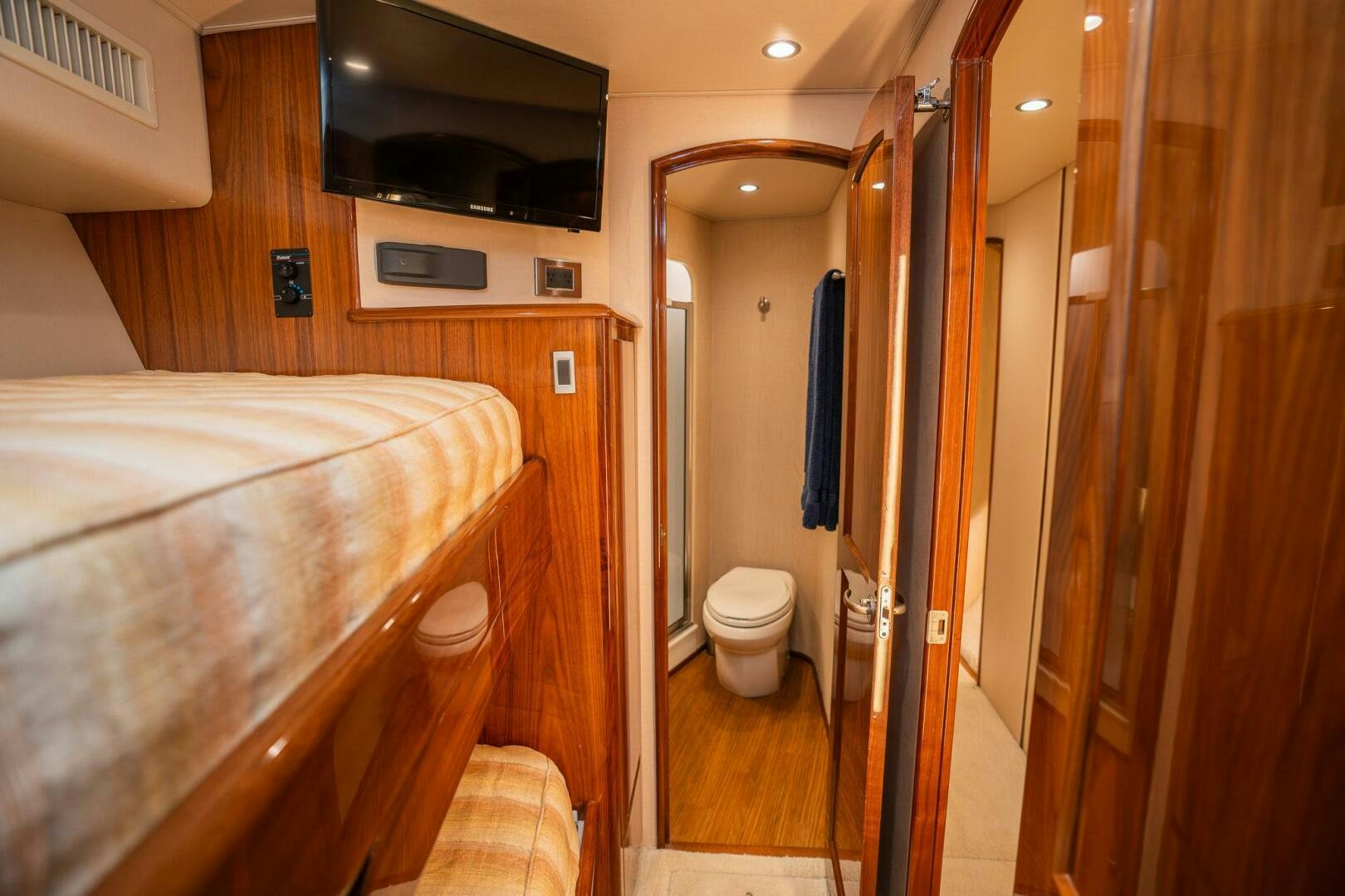 a bathroom with a bathtub and toilet aboard VOODOO Yacht for Sale