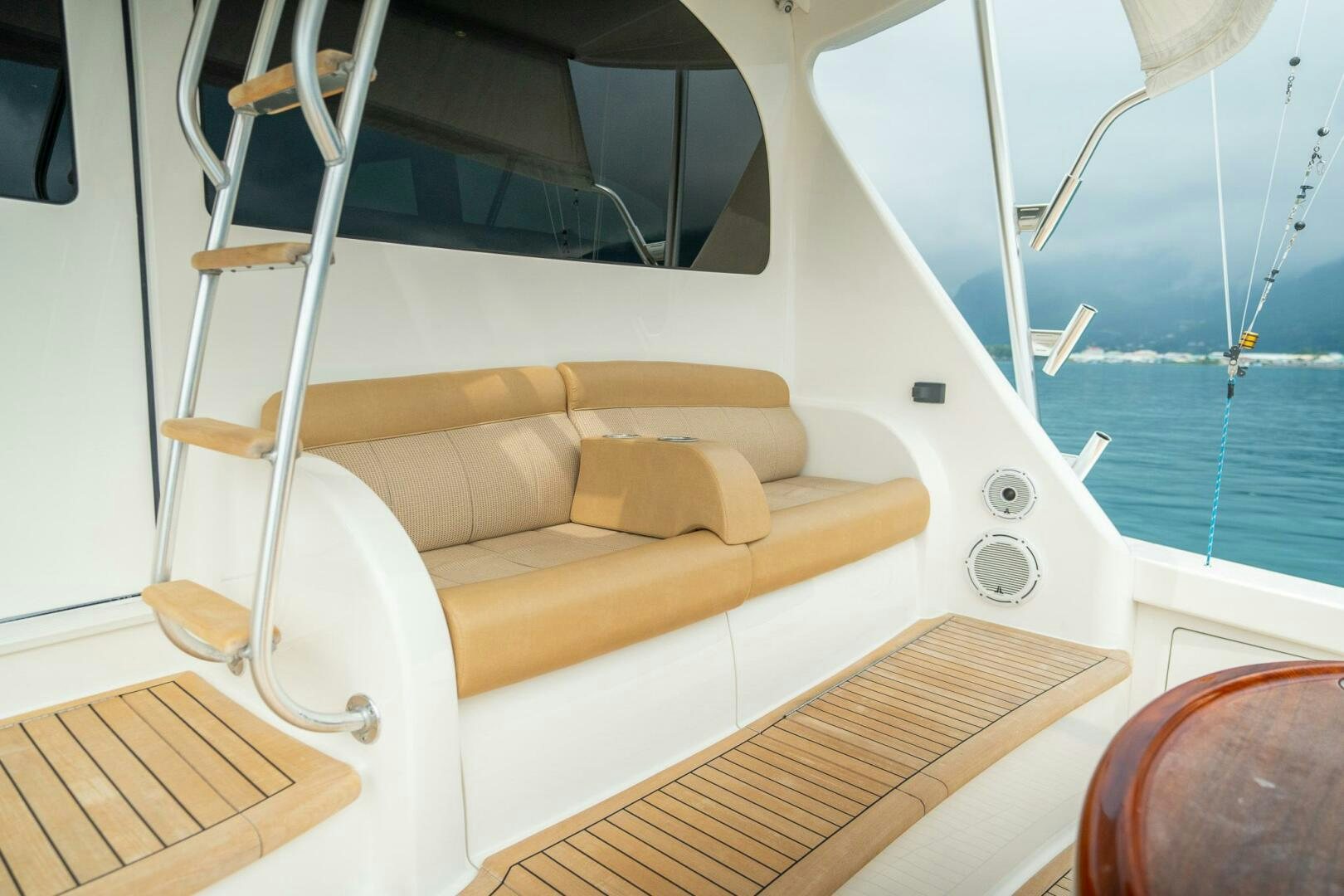a boat with a couch aboard VOODOO Yacht for Sale