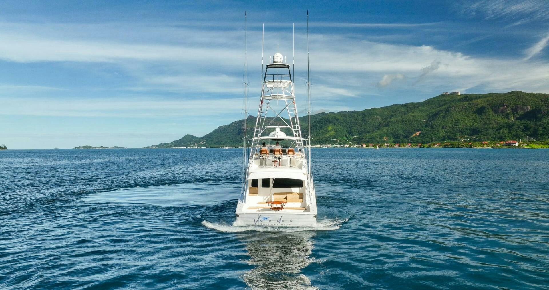a white boat on the water aboard VOODOO Yacht for Sale