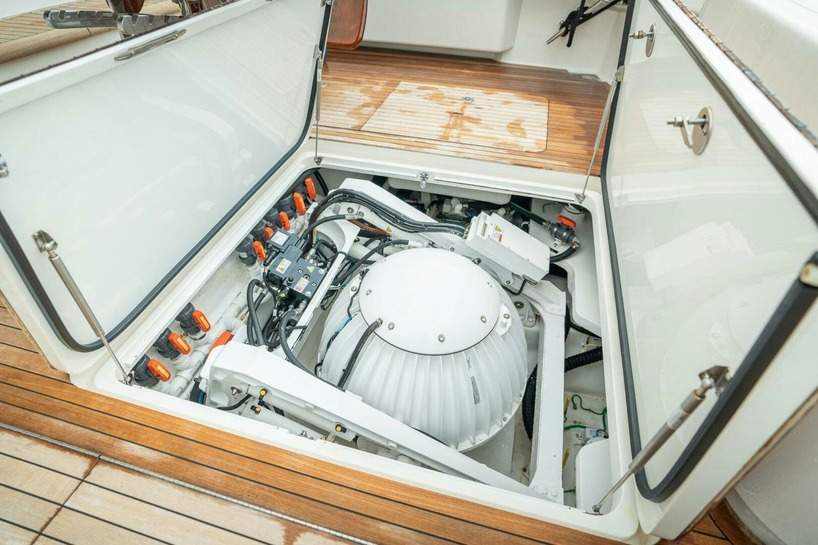 a white machine with a white circle on the front aboard VOODOO Yacht for Sale