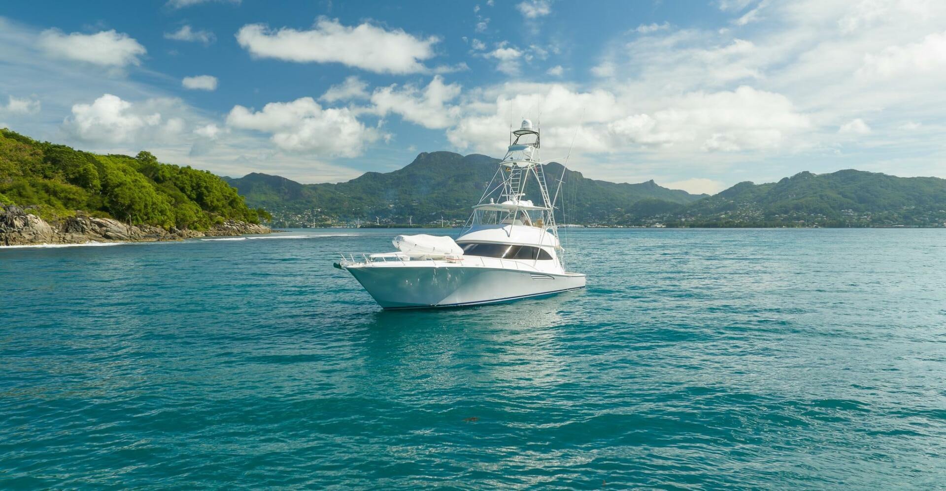 a white boat on the water aboard VOODOO Yacht for Sale