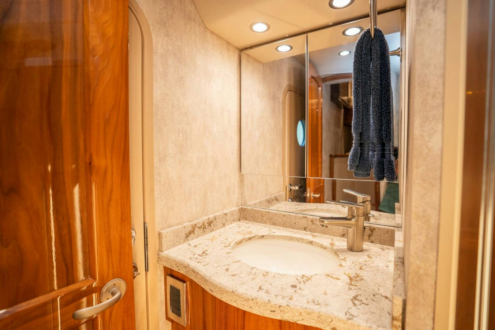 a bathroom with a sink and a mirror aboard VOODOO Yacht for Sale