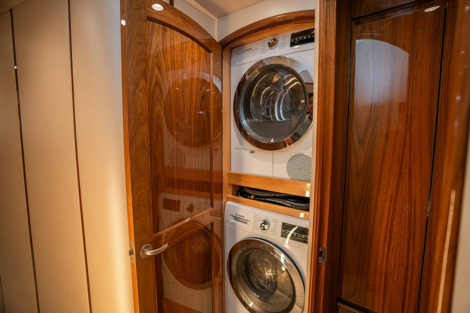 a closet with washer and dryer aboard VOODOO Yacht for Sale