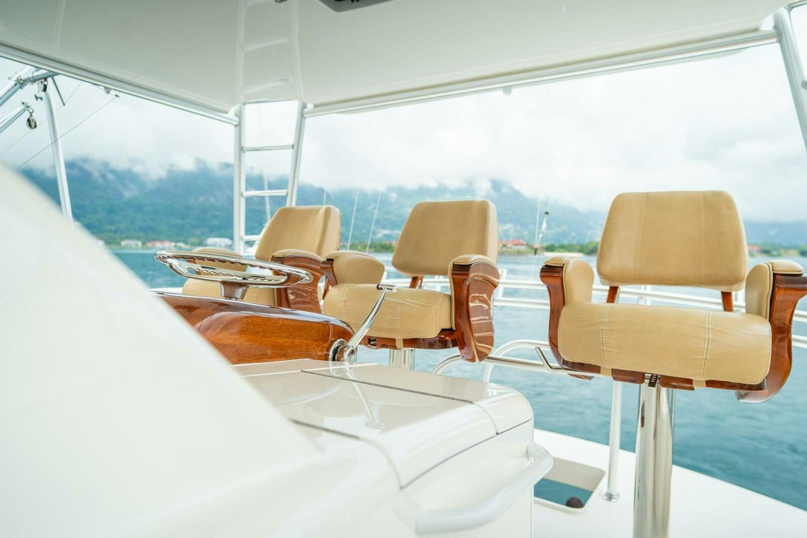 a boat with chairs around it aboard VOODOO Yacht for Sale