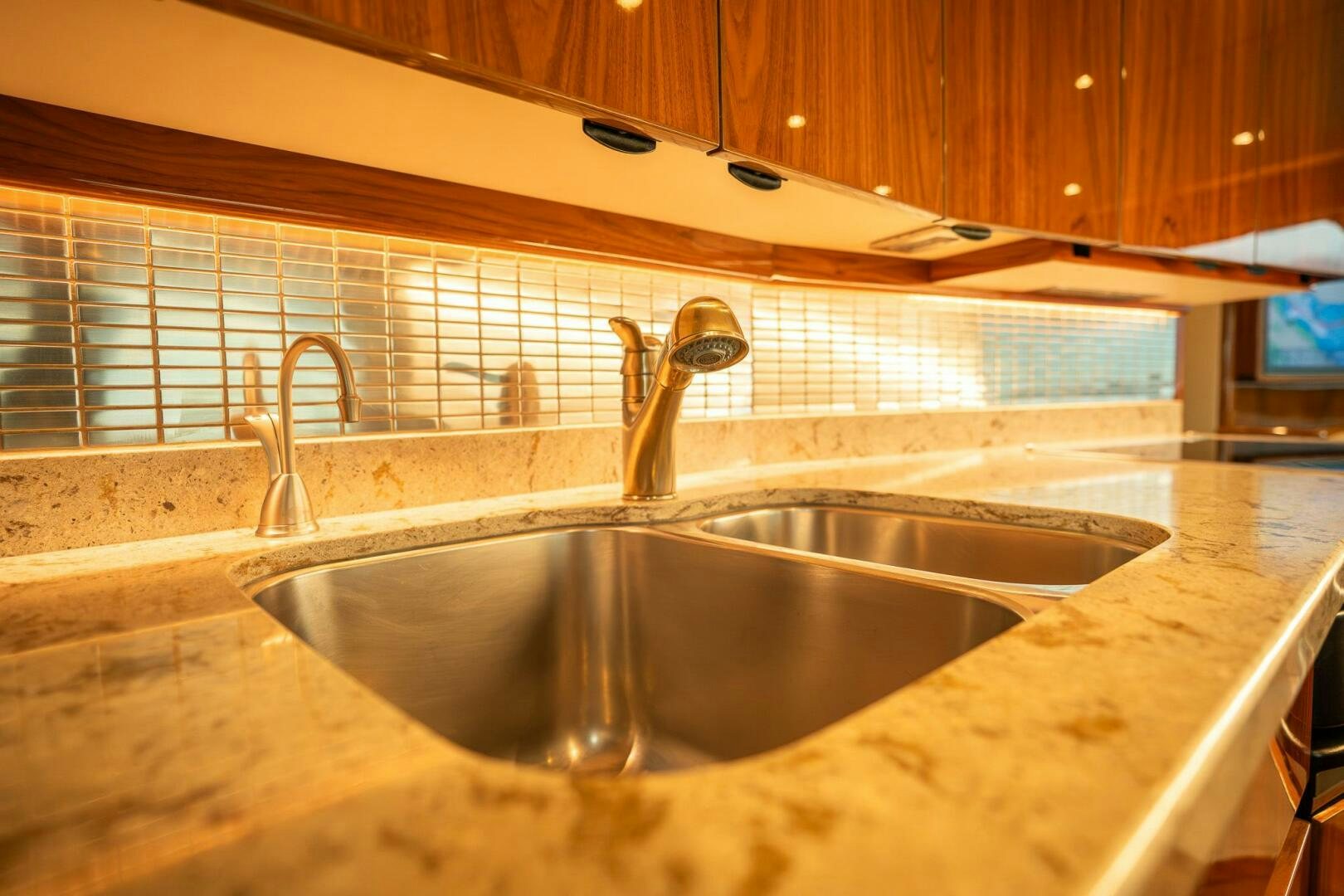 a kitchen sink with a faucet aboard VOODOO Yacht for Sale