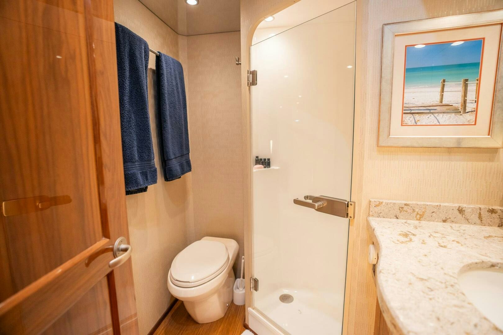 a bathroom with a toilet and sink aboard VOODOO Yacht for Sale