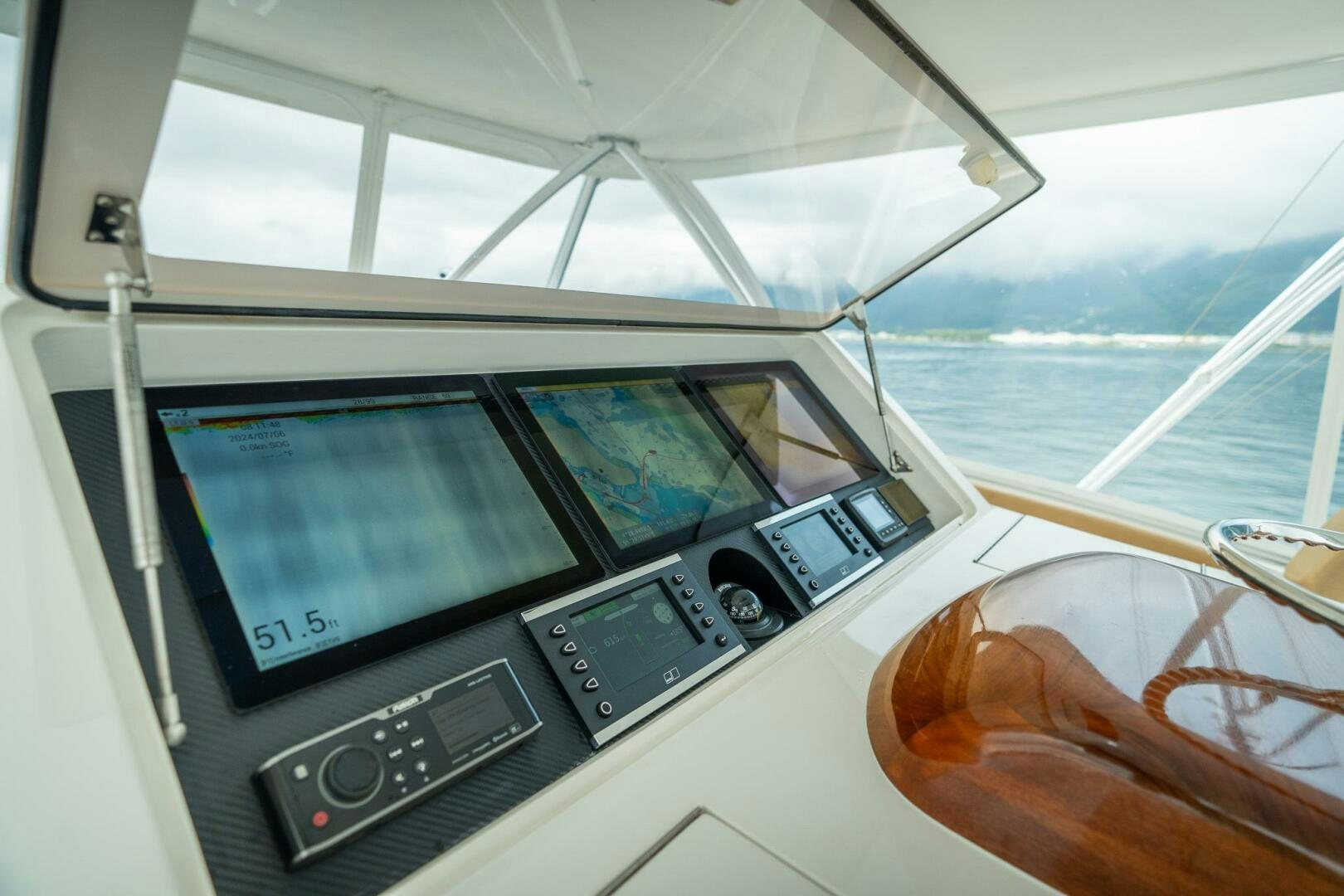 a boat with a screen and a steering wheel aboard VOODOO Yacht for Sale
