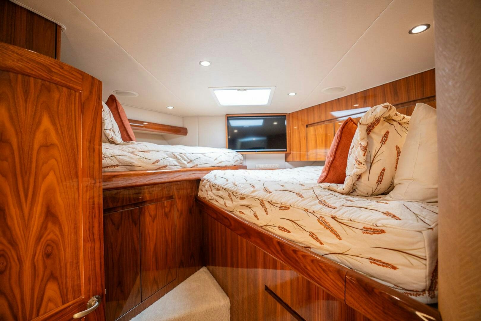 a couple of beds in a room aboard VOODOO Yacht for Sale