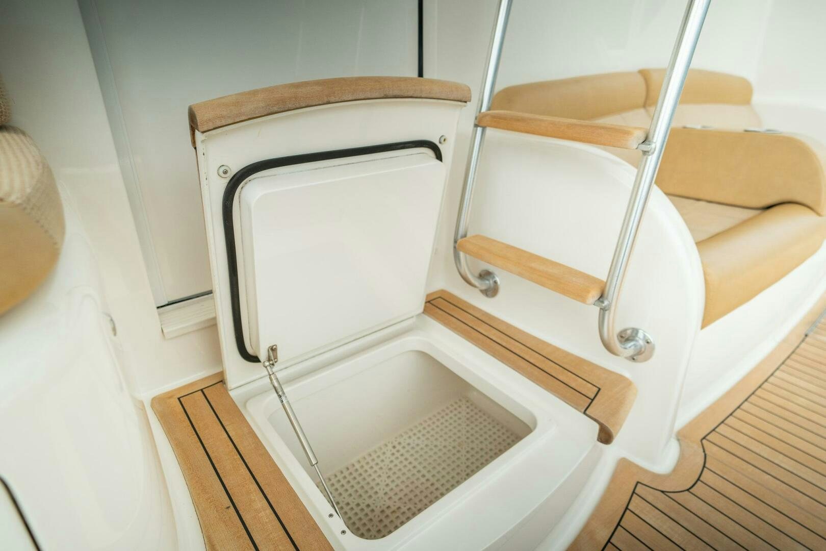 a white refrigerator in a room aboard VOODOO Yacht for Sale