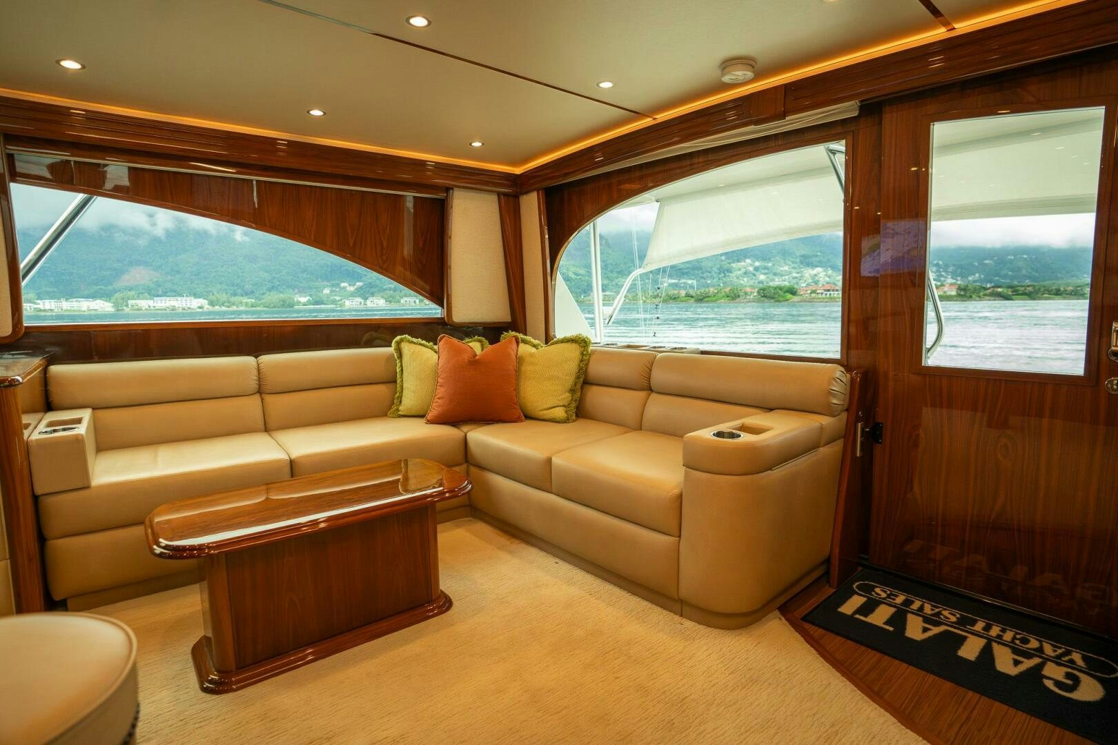 a living room with a couch and a table aboard VOODOO Yacht for Sale